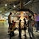 Guests of all ages view a display of gems in a museum that resembles a mine shaft